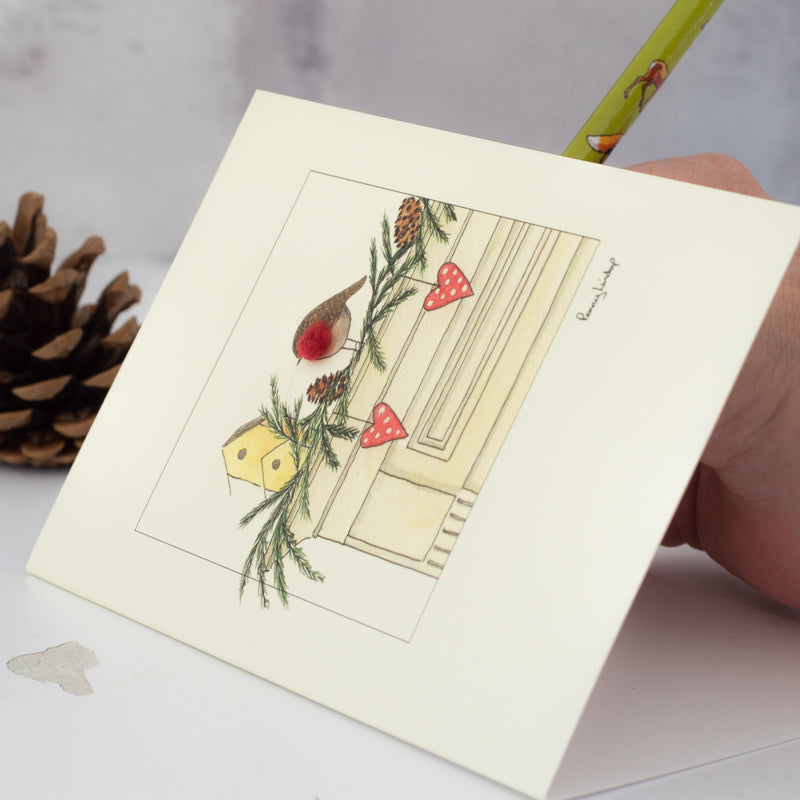Robin on a mantlepiece Christmas card
