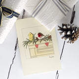 Robin on a mantlepiece Christmas card
