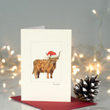 Highland cow in hat Christmas card