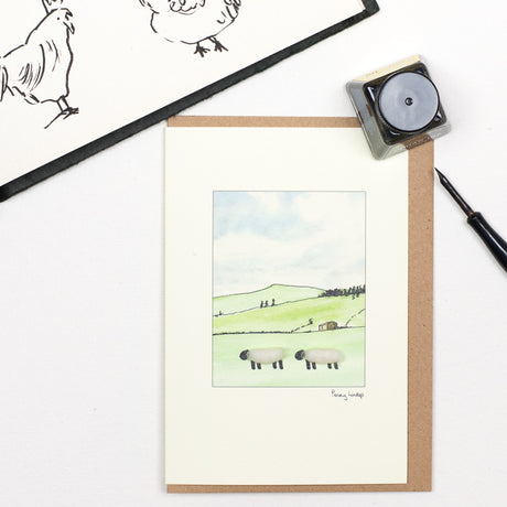 Sheep on hillside greetings card