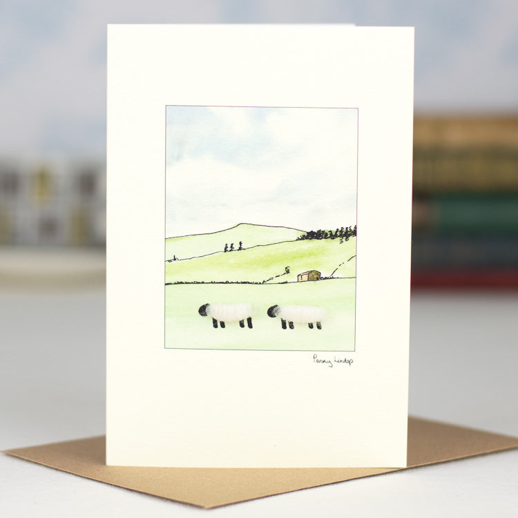 Sheep on hillside greetings card